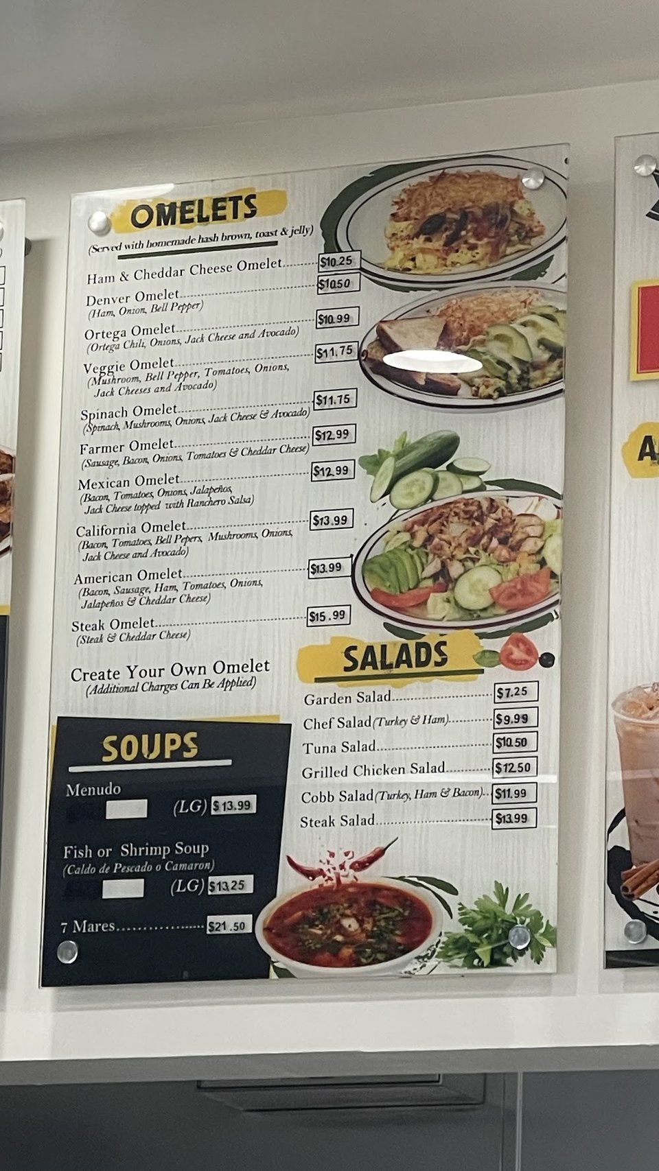 Mexican dishes served beside a hamburger plate.